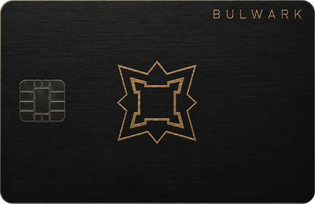 The Bulwark card — brushed black metal with a brass fort mark